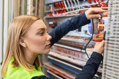 An electrician checking conductivity