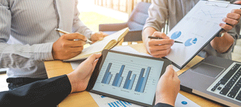 Business workers looking at charts