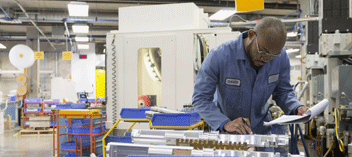 Technician at bench in production facility