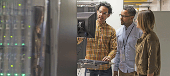 Technicians at data center monitor