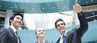 Business people looking upward and smiling