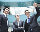 Business people smiling and looking upward.