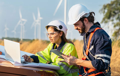 man and woman engineers working on clean energy