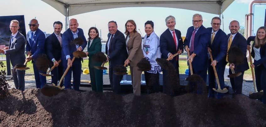 Group of people in business attire breaking ground on CHPE converter station.