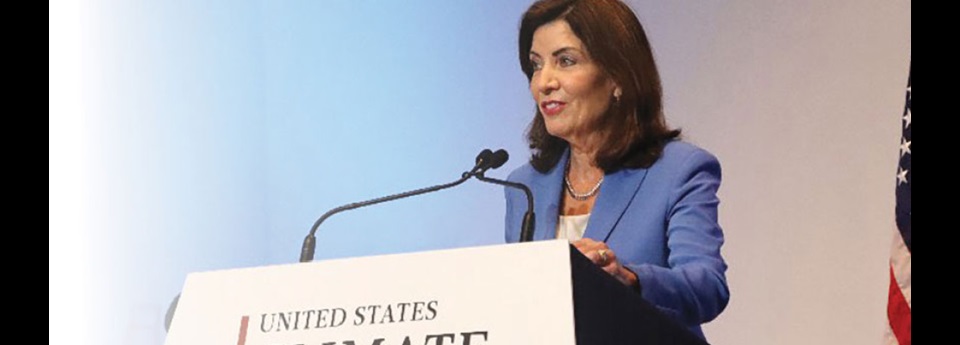 Kathy Hochul at podium giving speech.