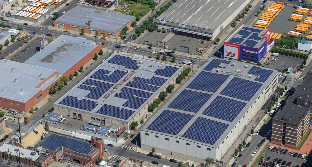 building rooftops with solar panels