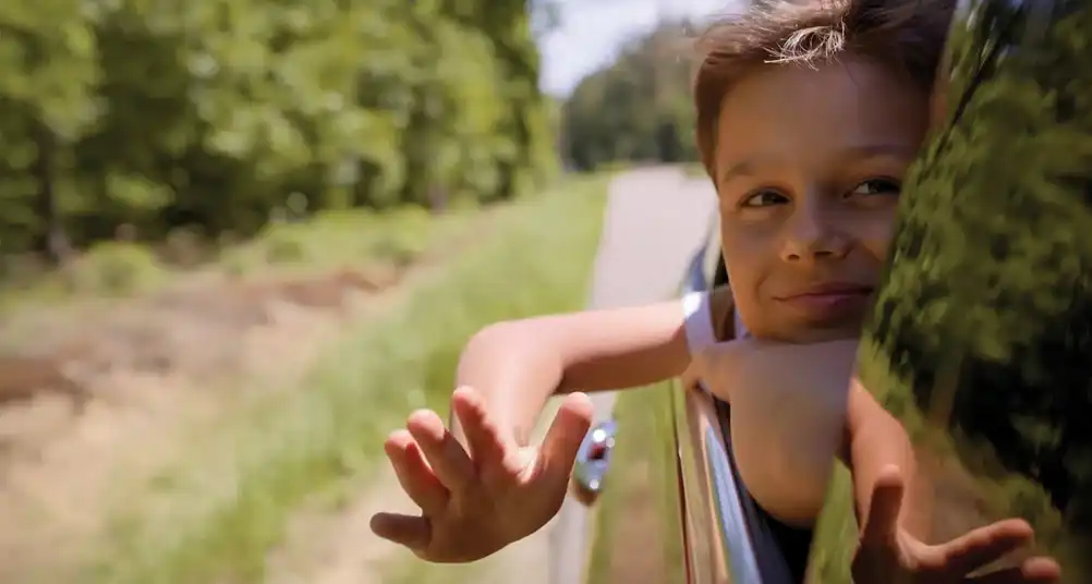 child looking out car window