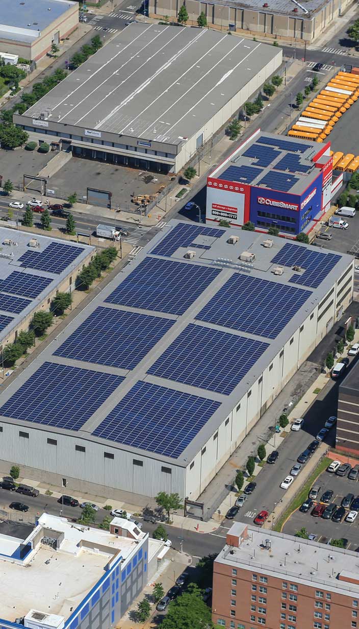 building rooftops with solar panels