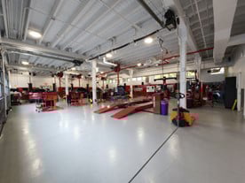 Vehicle garage outfitted with vehicle maintenance tools.