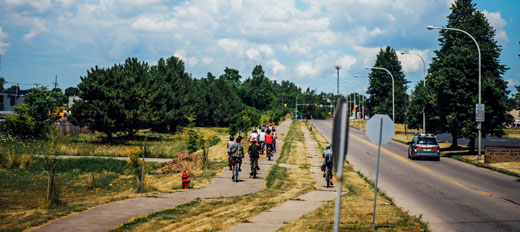 people riding on a bike trail