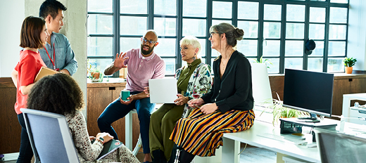 Diverse group of coworkers having a discussion in an office