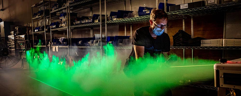Man working in green smoke