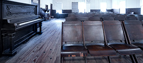 Empty chairs in performance hall 