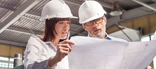 engineers looking over plans