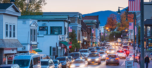 cars driving through town