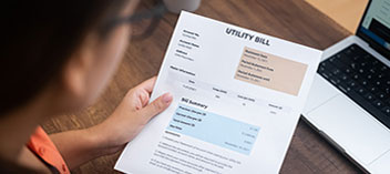 person reading utility bill