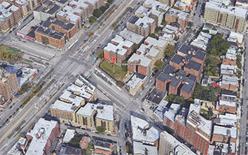 Birds eye view of a city block with a marker indicating the site for the 2050 Grand Concourse building to be built on.