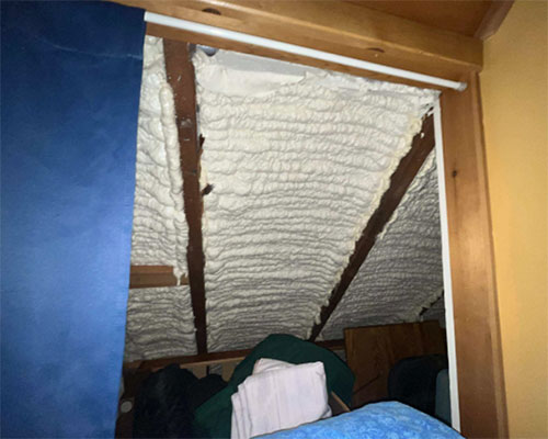 Spray foam insulation inside house.