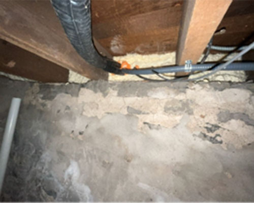 Piping and insulation inside house.