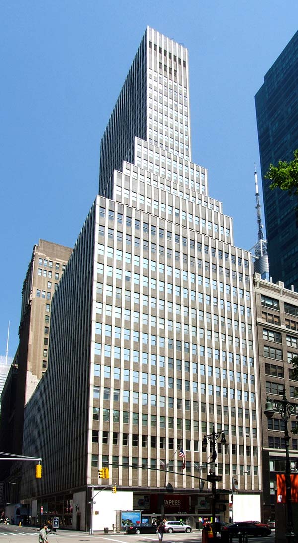 Street view of 5 Bryant Park, a 34-floor building with blue sky in the background.
