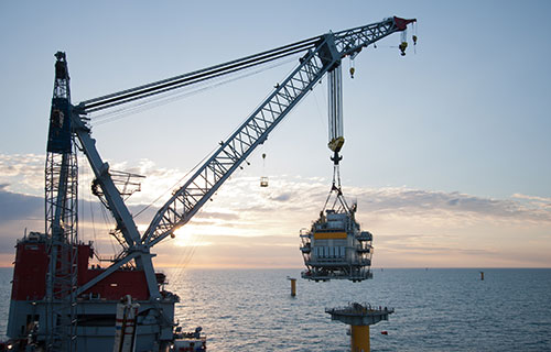 Crane being used at an offshore wind construction site.