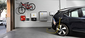 Image of a battery system installed on a garage wall 