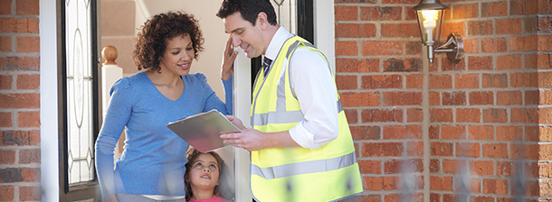 Women at a door talking to a contractor