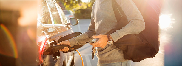 person fueling car