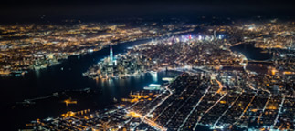 Coastal city at night, view from above