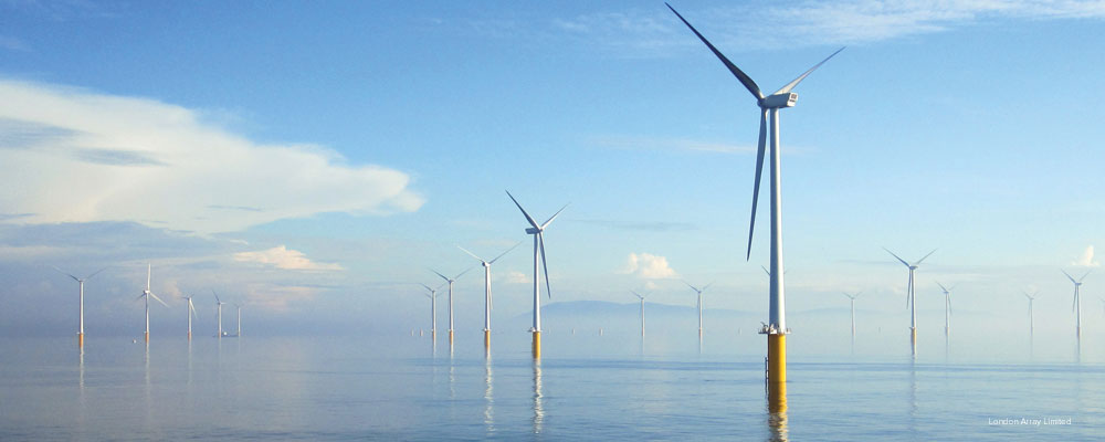 Offshore wind farm set agaisnt blurry horizon